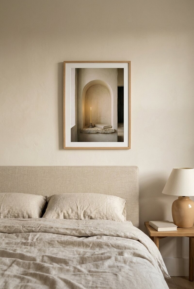 The Candle Niche framed above a linen headboard in a calm minimalist bedroom